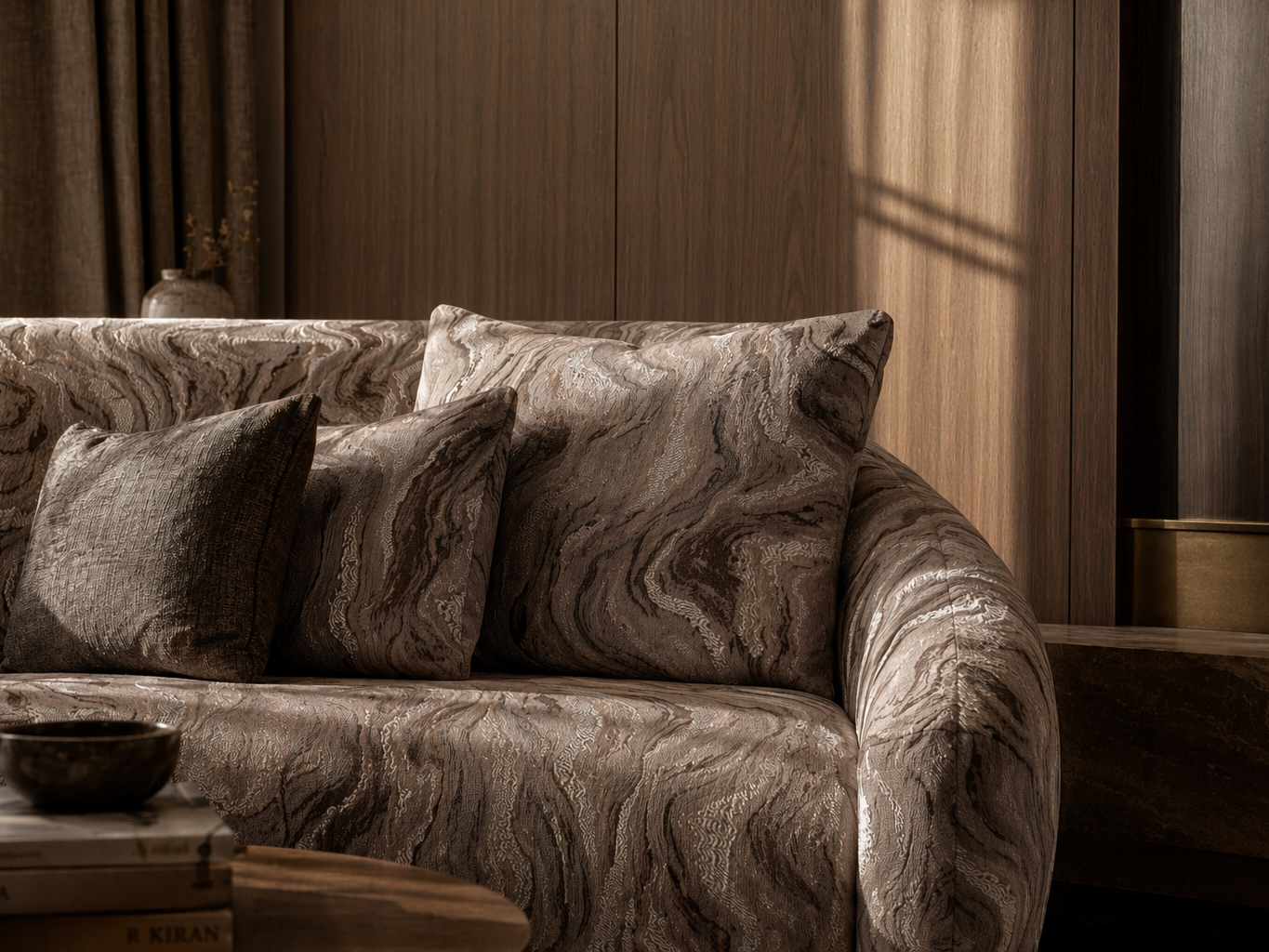 Contemporary sofa upholstered in rich brown marbled fabric with layered accent cushions - Beautiful Homes