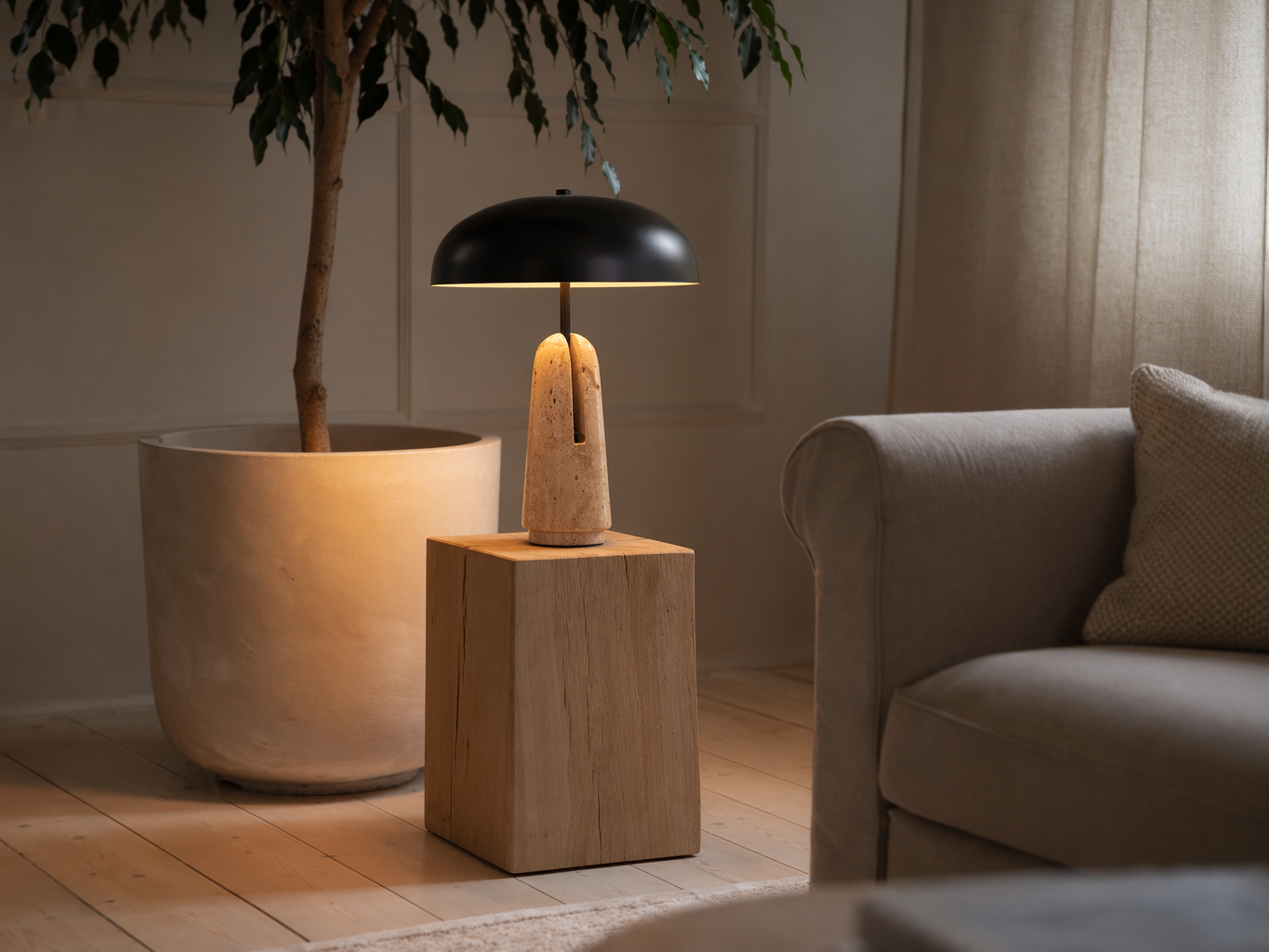Contemporary table lamp with a matte black dome shade and sculptural beige stone base - Beautiful Homes