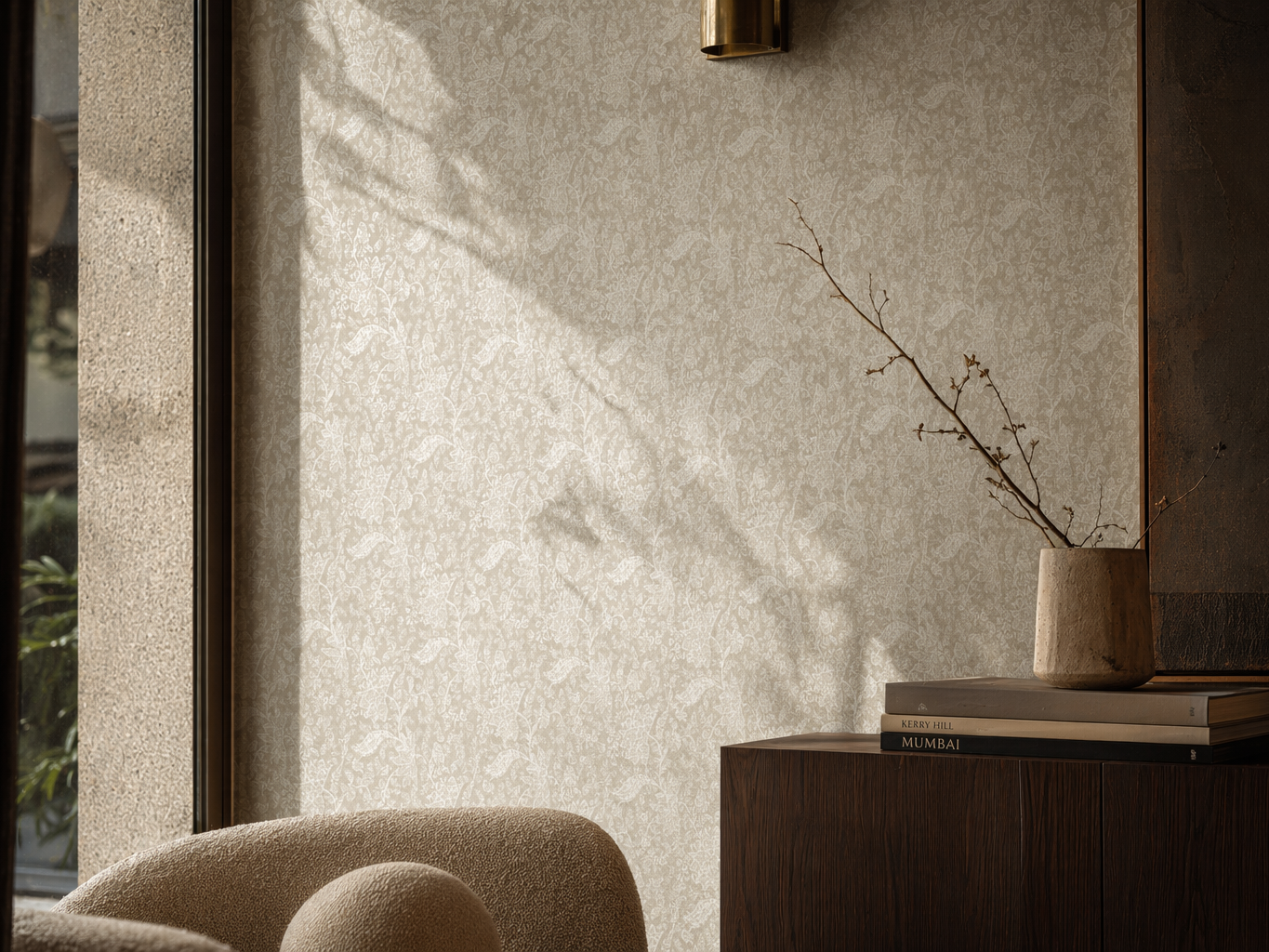 Beige wallpaper with a delicate floral damask pattern, styled behind a dark wood cabinet - Beautiful Homes