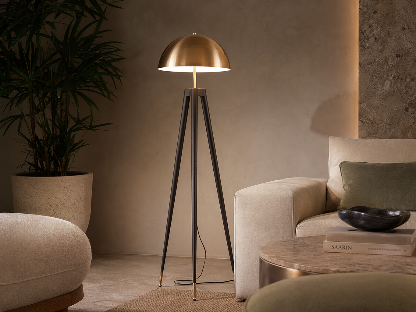 Floor lamp with a brushed brass dome shade, slim brass stem, and black tripod legs - Beautiful Homes