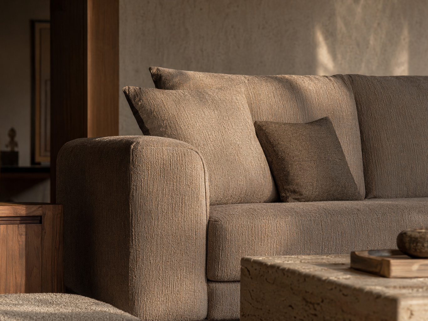 Contemporary taupe sofa with rounded arms and richly textured upholstery - Beautiful Homes
