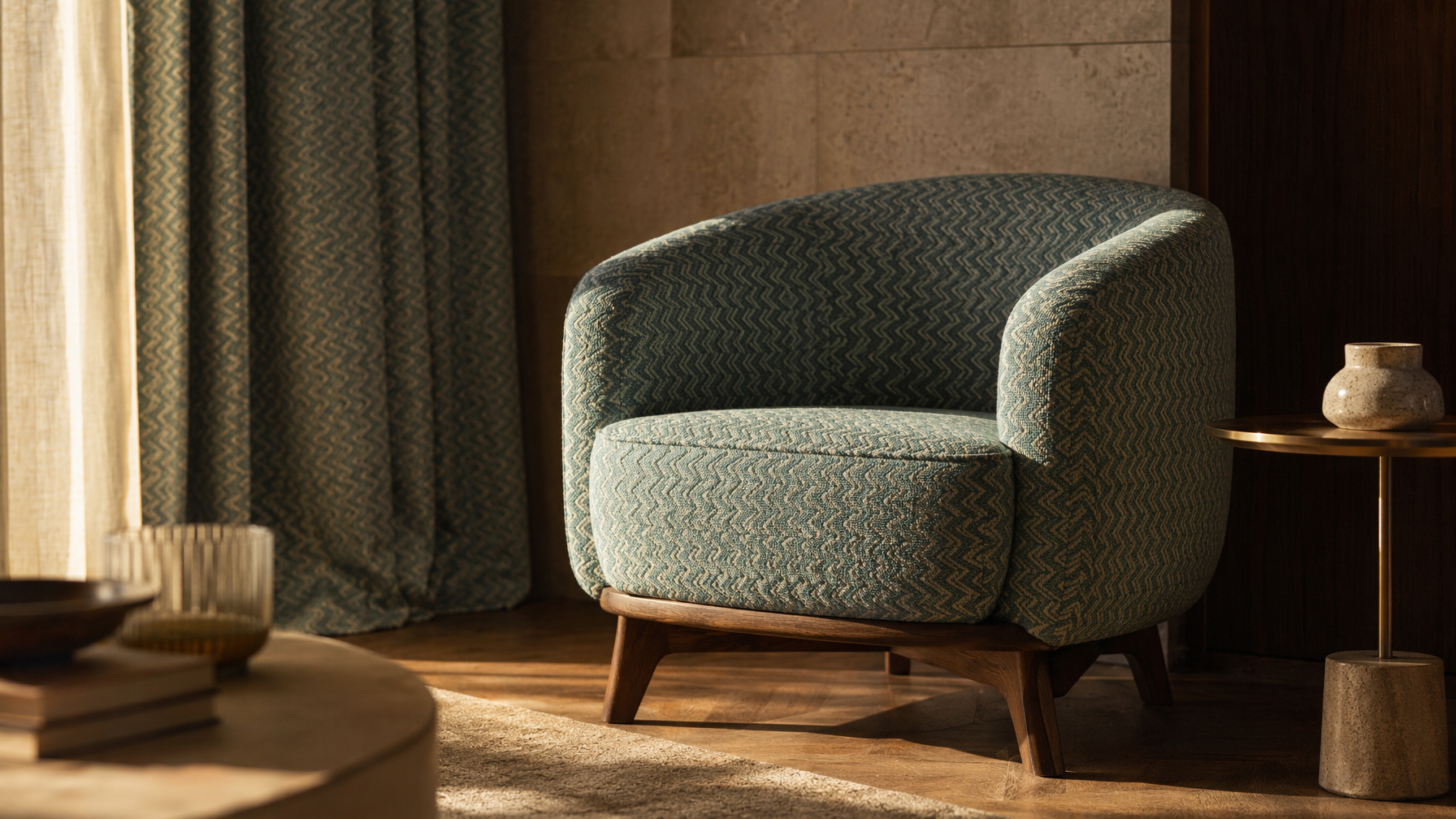 Upholstered sofa-style furnishing with teal and cream woven texture, rounded form, and dark wooden legs - Beautiful Homes