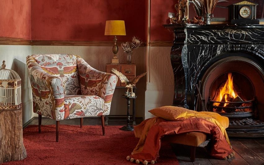 Use warm colour palette around fireplace for winter decoration - Beautiful Homes