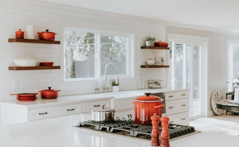 Lacquered glass used on the kitchen cabinets & countertop - Beautiful Homes