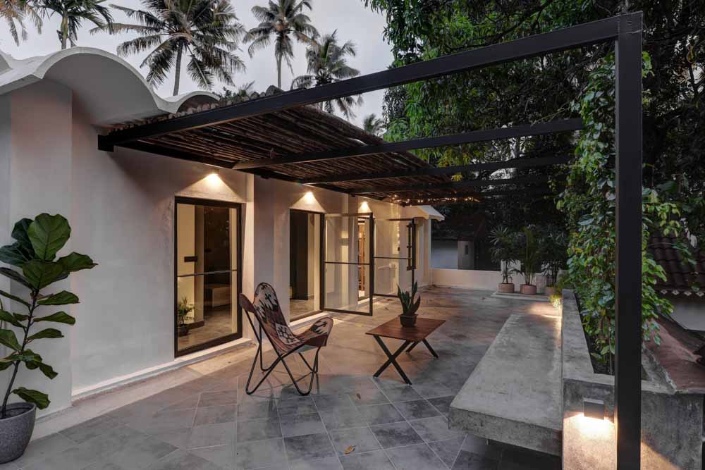 A patio with with a chair and a centre table - Beautiful Homes