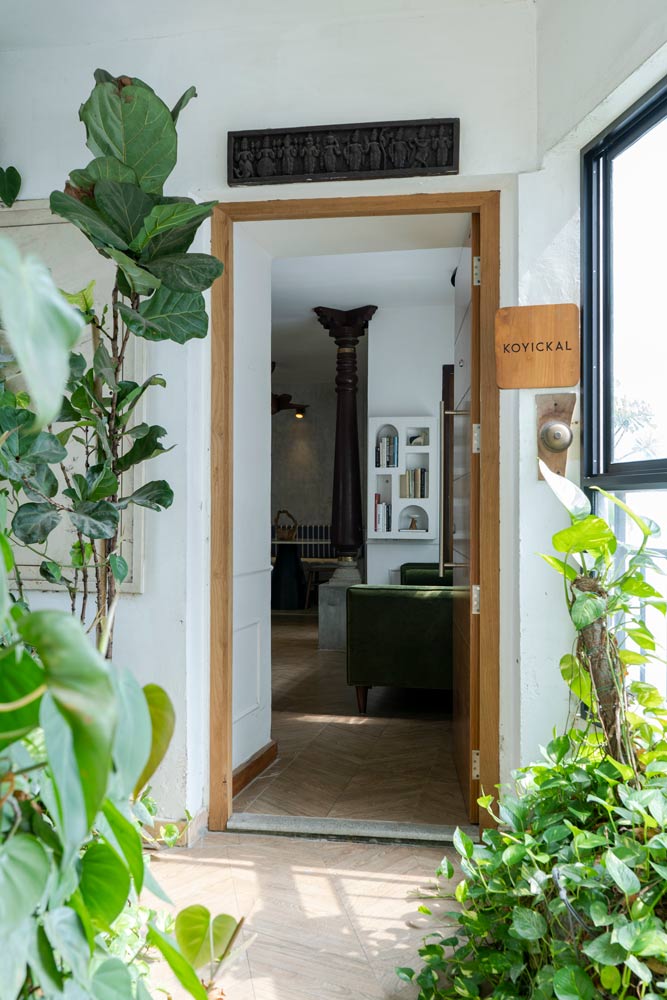 Entrance door to Anvitha &Naveen's home with decoration of outdoor plants - Beautiful Homes