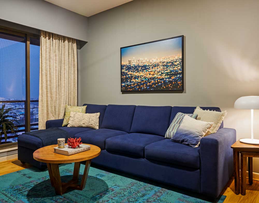 An entertainment room with a large L-shaped sofa - Beautiful Homes