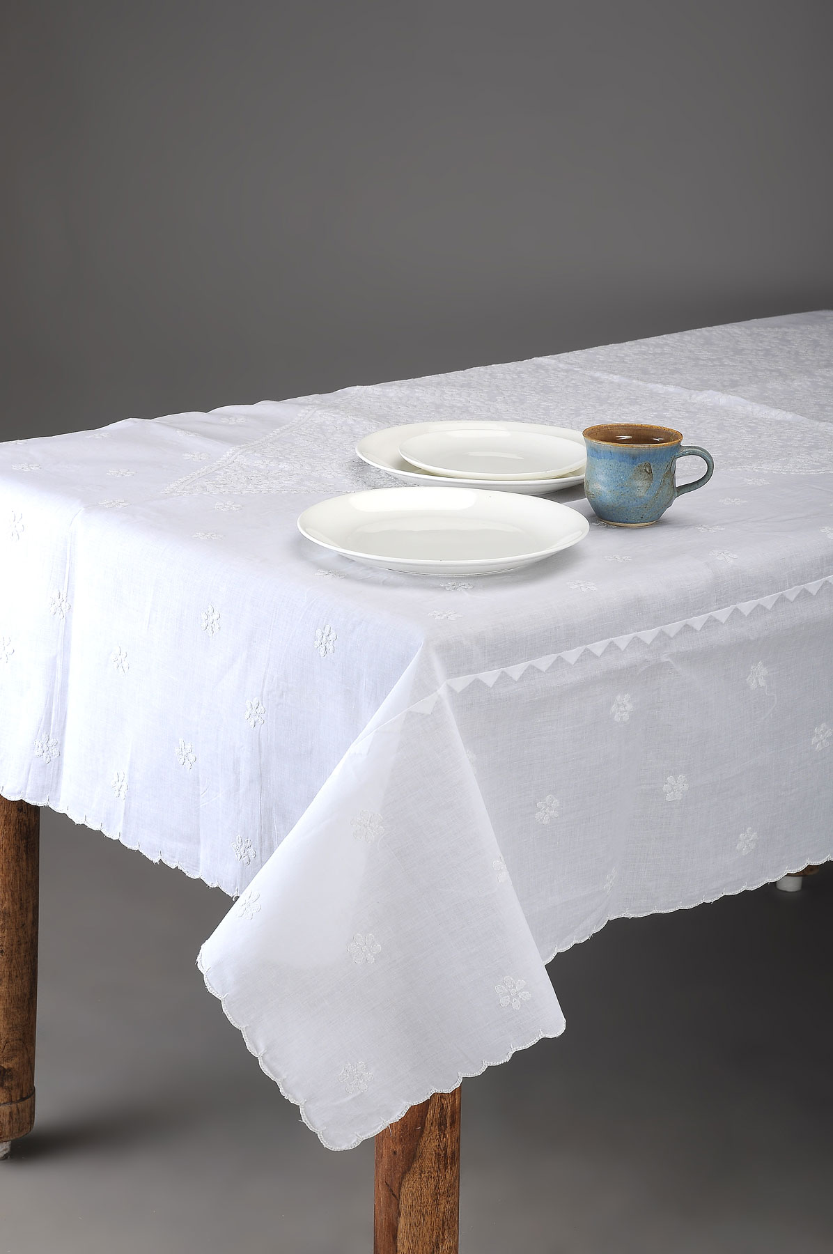 white chikankari cotton table cover with floral motif